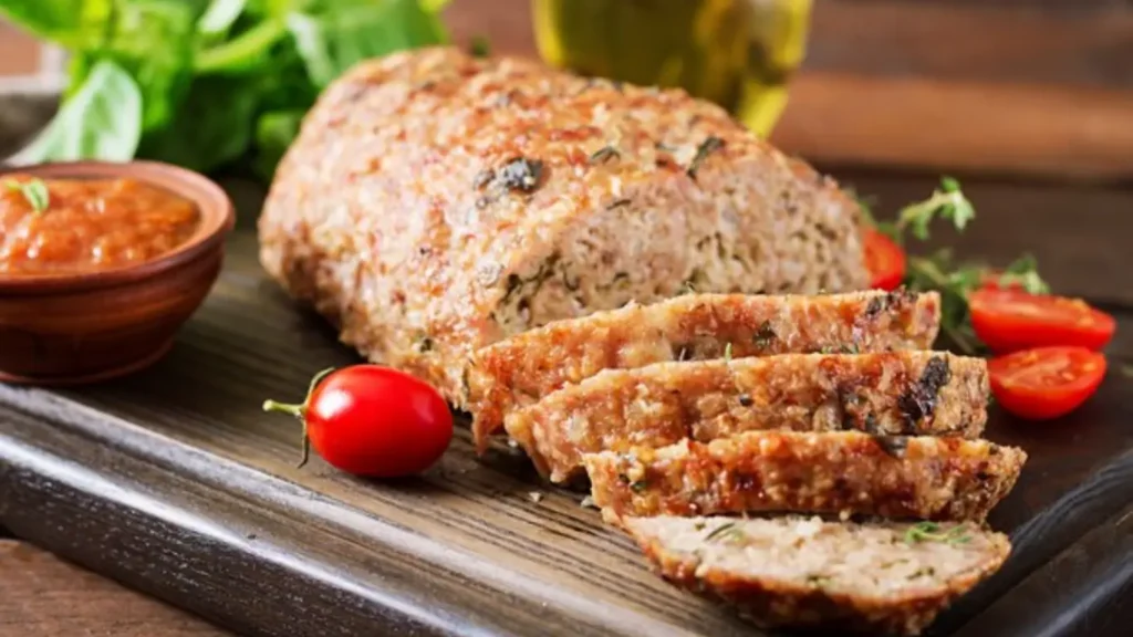 Meatloaf mixture with milk being added for a tender, flavorful dish.