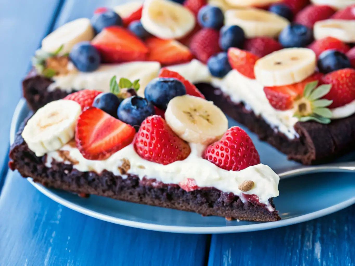 slice-of-fruity-brownie-pizza Slice of fruity brownie dessert pizza being served